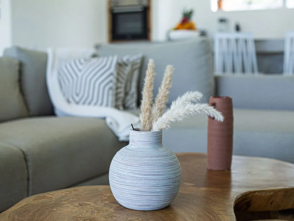 modern living room with pampas grass vases on wood coffee table
